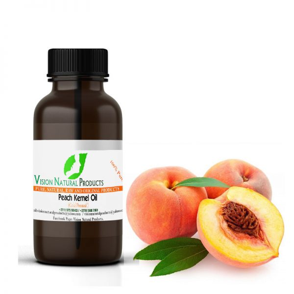 Бутылочка персикового масла и плоды